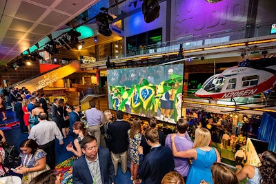 The Newseum atrium's 40-by-22-foot projection screen served as the main viewing spot for the opening ceremony.