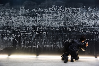 The Bruce High Quality Foundation's 'As We Lay Dying: Lecture Notes,' featured twice throughout the walking path, was the only interactive installation on the grounds. Characters on hand recited words on the expansive chalkboard, and guests could also contribute their own notes, messages, or sayings. The chalkboards, set up on raised wooden platforms with seating areas, also served as a palette cleanser of sorts during the tour.