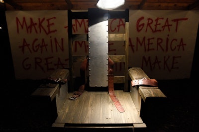 Flanking the north end of the Watermill Center's Clementine Hunter House was Pussy Riot's 'Make America Great Again' sculpture. The husband and wife artist duo Nadya Tolokonnikova and Pyotr Verzilov's political commentary featured a 1920s electric chair centered in front of a facade emblazoned with the tongue-in-cheek reference to Republican presidential nominee Donald Trump's slogan.