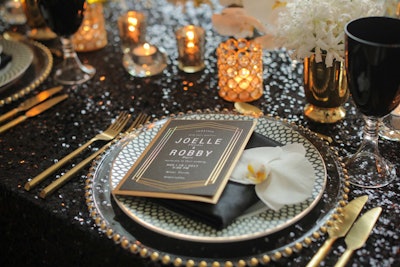 Golden flatware, chargers, and candleholders contributed to the opulence of the tabletop look.