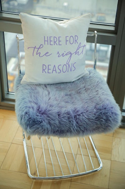 A throw pillow topped an eye-catching purple seating cushion. Printing that said, 'Here for the right reasons' recalled a frequently repeated saying on the show.