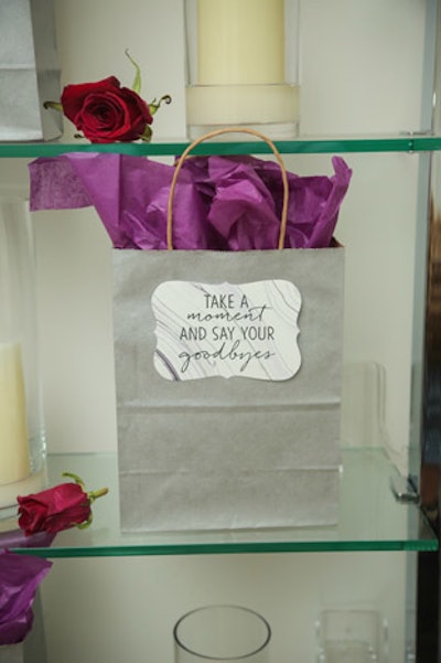 Tags that read, 'Take a moment and say your goodbyes' festooned gift bags.