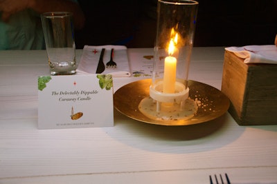 Guests dipped bread into melting beef tallow candles that were infused with caraway spice.