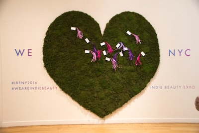 The expo entrance featured a moss-covered 'wishing heart,' which was inspired by a Japanese wishing tree. Guests could write down what indie beauty meant to them on the decorative tags and attach them to the wall.