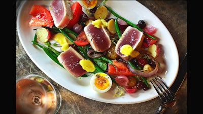 Yellowfin tuna with haricots verts, heirloom tomatoes, olives, soft egg, and saffron aioli.