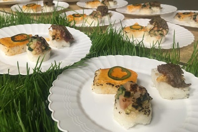 Purple Onion Catering demonstrated how to make aburi—or torched—sushi at a catering station for events during its session of the round-robin series. Attendees sampled options for salmon, beef, and tuna.