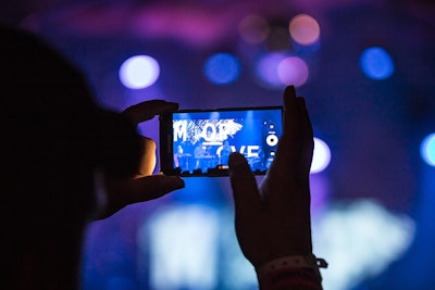 A concertgoer records a performance at the Panorama Music Festival, which took place July 22 to 24 at Randall's Island, New York.