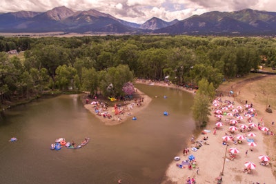 Cottonwood Meadows property owner Jed Selby created a manmade beach, which transformed into the Bee Vee Beach Club. Helmed by DJs with panoramic mountain views each day, guests lounged under striped umbrellas, which were brought in to enhance the scene.
