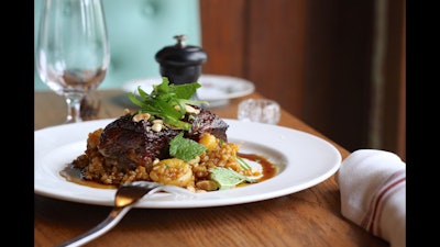 Wood roasted short rib with farro risotto, Marcona almonds, apricot, and mint.