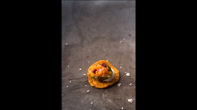 Sweet potato crisp with a fried Brussels sprout cup, root vegetable, and beet salad with goat cheese puree