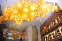 At the House of Kim Crawford—a fashion-focused event on August 3 in New York—a golden balloon installation designed by Jessica Fels Event Production and Design and executed by Mixed Greens Events created an eye-catching focal point. The summery event, which also featured bottle art installations, a fortune-cookie tree, and a silhouette-artist station, was produced by Fels and Shadow.