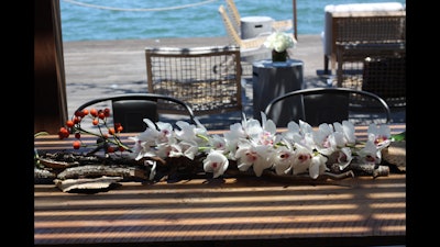 Orchid and driftwood table arrangement