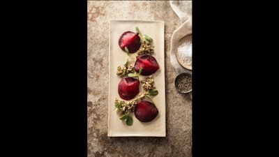 Beet ravioli, herb chevre, sunflower sprouts, and pumpkin seed granola