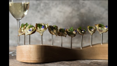 Mini fried artichokes with champagne aioli, borage flower, and petite herbs