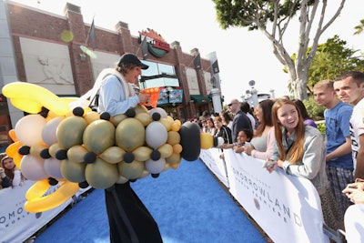 A stilt walker outfitted in a balloon spaceship greeted fans at the world premiere of Disney’s Tomorrowland, which took place at Disneyland in Anaheim, California, in May 2015.