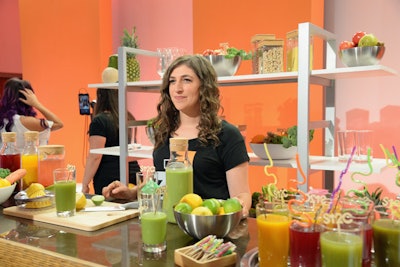 Mayim Bialik manned the juice bar setup within the backstage Hub.