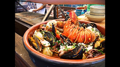 Fideuà is a seafood dish similar to paella but with noodles instead of rice.