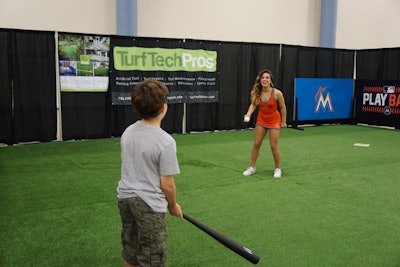 The Miami Marlins baseball team installed an interactive playing field supplied by nearby exhibitor Turf Tech Pros. Visitors could go to bat with Marlins brand ambassadors or participate in prize giveaways.