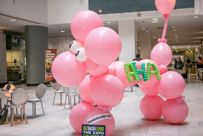 Self-taught “balloon twister” Addi Somekh makes unique, larger-than-life balloon installations, such as the pink poodle that greeted guests at the event registration area at BizBash Live: The Expo Los Angeles, which took place in July at the California Market Center. In addition to funky decor, Somekh can provide live demonstrations for events, creating balloon hats and inflatable crowns custom-designed for guests’ personalities and style.