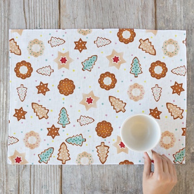 A playful frosted cookies-printed place mat from Minted is available in various table runner sizes and as a napkin; place mats cost $24.