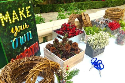 For a family-friendly holiday party at a private home in Los Angeles in December 2015, Seed Floral set up a wreath-making station and make-your-own snow globe and ornament stations.