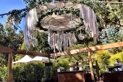 For a destination wedding in Big Sur, California, producer and designer Sterling Engagements suspended a 12-foot dream catcher decor piece above the dance floor.