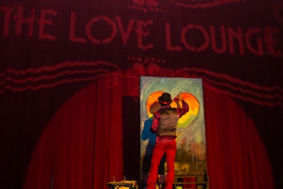 Organizers dubbed the V.I.P. lounge the 'Love Lounge,' and incorporated red decor, red lighting, and a painter who created a rainbow-colored heart during the event.