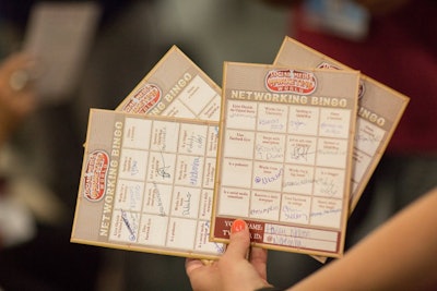 At the opening-night party, attendees played “Networking Bingo” by gathering Twitter handles of fellow guests that met the criteria indicated in the boxes.