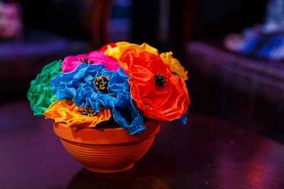 Paper flower decor added color to the Mexico-theme ballroom space.