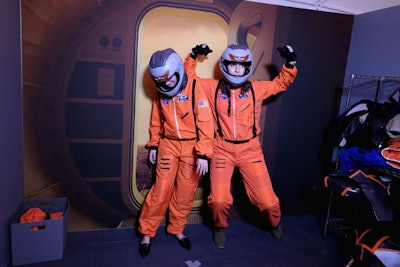 At a photo booth, guests could dress up as astronauts.
