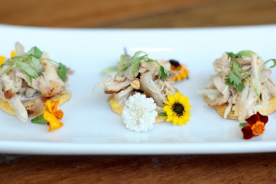 Pulled beer-can chicken, served on corn cakes with pickled watermelon, by the Innovative Dining Group in Los Angeles