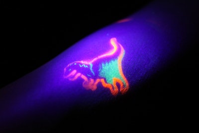 Lighting amplified the dinosaur and neon themes, even in details like temporary tattoos.