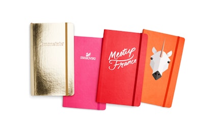 Office furniture and accessories retailer Poppin offers an array of customized supplies for companies, from soft-cover notebooks to tape dispensers, available in bright, eye-catching colors. Pricing ranges from $1.50 to $22.