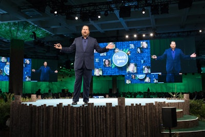 Salesforce C.E.O. Marc Benioff was one of dozens of keynote speakers at the event. To tie into the theme, wood logs lined the keynote stage and background decor evoked a forest setting.