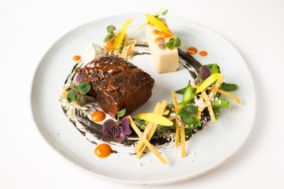 Slow-cooked short rib with jalapeño con queso tamale, huitlacoche puree, Modelo mole, cabbage slaw, and lime crema, by Cloud Catering & Events in Long Island City, New York