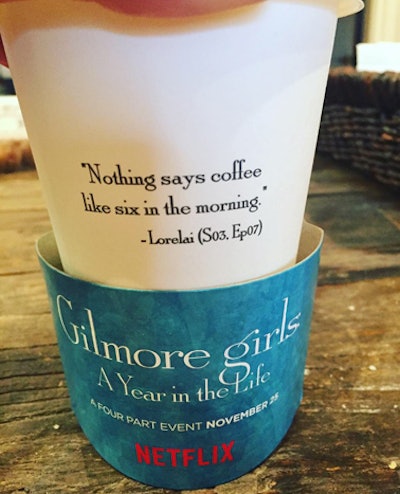 Fans who waited in line received coffee in branded cups that were printed with coffee-theme quotes from the series. The sleeves promoted Netflix's four-part reboot, which will be released next month.