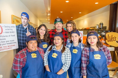 Netflix's Gilmore Girls pop-up tour took place October 5 at 200 coffee shops. Staff and brand ambassadors wore Luke's Diner aprons and branded hats.