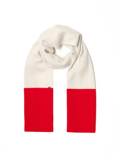 A cashmere knit color-block scarf for $445 from St. John Sport makes a chic and practical take-home gift for winter parties.