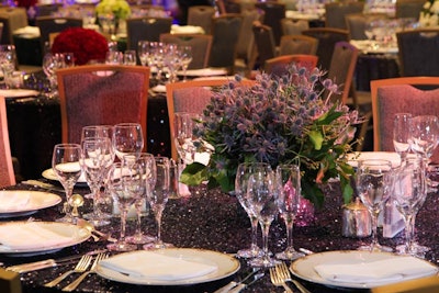 Millicent Bluford created a mix of floral centerpieces including these with thistle, cabbage, and miniature carnations.