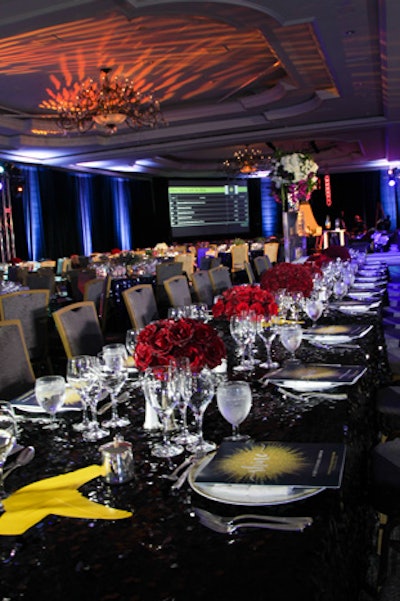 Events by Andre Wells, who produced this year's gala, used two king's tables on each side of the stage for the Knock Out Abuse founders, co-chairs, and V.I.P.s, in contrast to the rounds of 10 used for general seating in the ballroom. Tight arrangements of dark red roses adorned the tables.