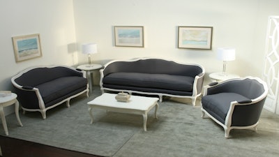 Gray linen French-style loveseat and club chairs in antique white finish