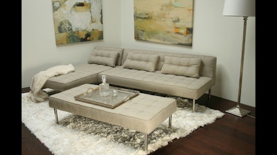 Light gray tweed sectional and ottoman