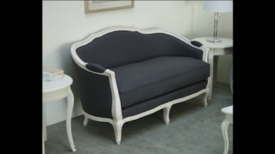 Gray linen French-style love seat in antique white finish