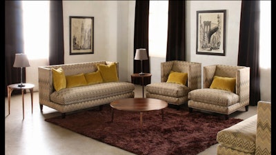 Sofa and club chairs with nailhead trim and chartreuse velvet pillows