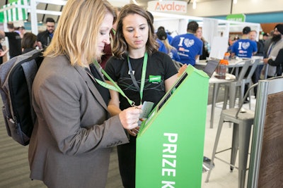 The N.F.C. scanner was housed in a tower wrapped with the event's colors and branding. On each of the conference's three days, staff moved it around the two exhibit halls and shared clues about the location in the event app.