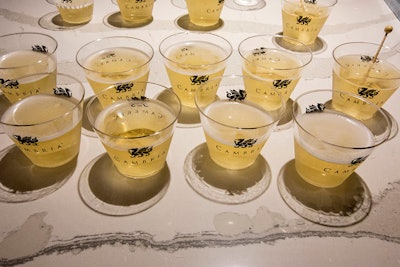 Cambria, a natural-made quartz producer, brought in a bar to showcase its product. Servers mixed champagne vodka, then garnished the drinks with sugar rock crystals and served them in branded cups.