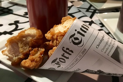 The savory food stations on the first and second floor served popcorn chicken and tater tots in paper cones made from mock editions of The New York Times.