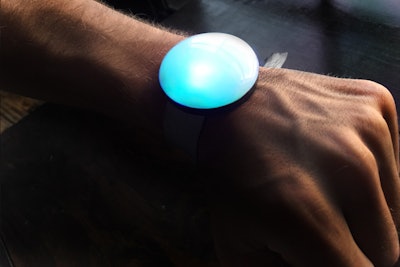 Event guests receive a wristband with an LED button, known as a Pixl, attached. Each one comes with a unique code that is used to activate the device via text.