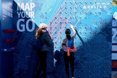 Delta invited runners to map their routes with string on a large map of Manhattan.