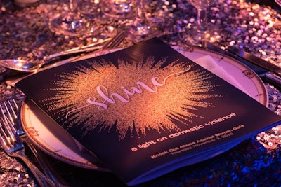 The 'Shine' graphic used on the invitations also served as the cover graphic for the night's programs on each place setting.